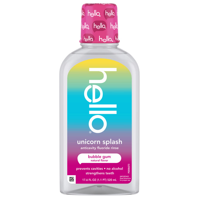 A bottle of hello Unicorn Splash Kids Mouthwash with Fluoride, alcohol-free and in bubble gum flavor, has a pink cap and rainbow label. It helps prevent cavities and strengthens teeth for happy smiles.