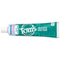 A tube of Tom's of Maine Sensitive + Whitening Fluoride Free Toothpaste on a teal background features phrases like Do a little good today, Fresh, and Vegan, with blue and green packaging highlighting rapid sensitivity relief and a white cap.