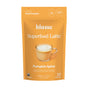 An orange bag labeled blume Organic Pumpkin Spice Latte Powder with a latte image. This superfood powder uses real organic pumpkin, has only 1g sugar, is caffeine free, and makes 25 servings.