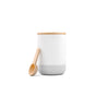 The Dirty Labs Refillable Ceramic Canister features a white cylindrical design, bamboo lid, matching wooden scoop, gray base, and embossed branding near the bottom.