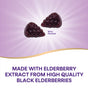 Two dark purple, berry-shaped Sambucus Elderberry Gummies by Natures Way rest on a radiant purple background labeled Berry Flavored. Text below reads: Made with elderberry extract from high quality black elderberries for immune support.