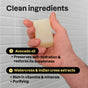 A hand holds ATTITUDE’s super leaves Men Body Soap Bar in front of a tiled wall. Text highlights clean ingredients: avocado oil for hydration, and watercress & Indian cress extracts for vitamins and purifying benefits.