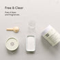A container of Dirty Labs 2-in-1 Bio Enzyme Dishwasher Detergent + Booster, a wooden scoop, a small beaker, and a dish of white powder are arranged on a light surface. Text reads: “Free & Clear. Free of dyes and fragrances.” Powered by bioenzymes and our clean rinse formula for effective results.