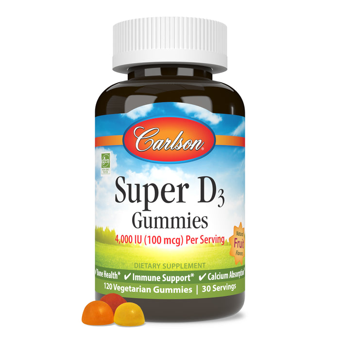 A bottle of Carlson Labs Super D Gummies is shown, containing 120 vegetarian vitamin D3 gummies. Two gummies—a yellow and an orange—sit in front. The label features fruit flavors and promotes immune support.