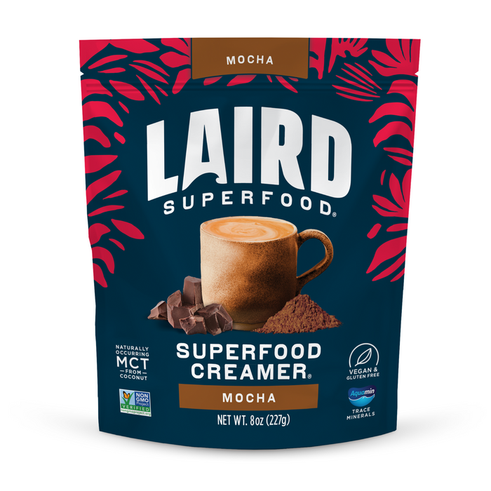 A bag of Laird Superfood Mocha Superfood Creamer with raw cacao, coffee, dark chocolate pieces, and powder on the front. The vegan, gluten-free, non-GMO package features a red leaf design at the top.