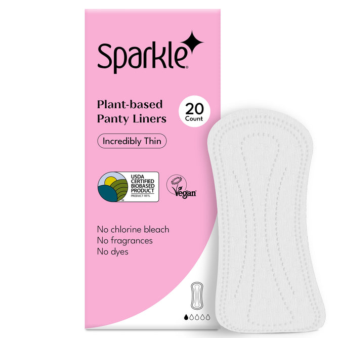 A box of Sparkle Panty Liners, 20 count, with a white liner beside it. The packaging highlights these hypoallergenic liners as incredibly thin, Vegan Approved, and free from chlorine bleach, fragrances, and dyes.