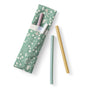 Esembly Baby’s 4-pack Reusable Silicone Sipper Straws come in pastel pink, white, green, and yellow. Stored in a green floral pouch made from upcycled materials, they offer eco-friendly sipping at home or on the go.