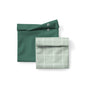 The Esembly Baby Reusable Snack & Sammy Food Pouches, 2-pack, feature two standing bags—one solid dark green with snap buttons and one light green with a white grid—offering a stylish landfill-free alternative for your waste-free lunchbox.