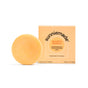 A round, orange Sunniemade Moisturizing Conditioner Bar - Mighty Mango rests next to its matching box. The simple, plastic-free packaging highlights the nourishing mango butter inside for added moisture.