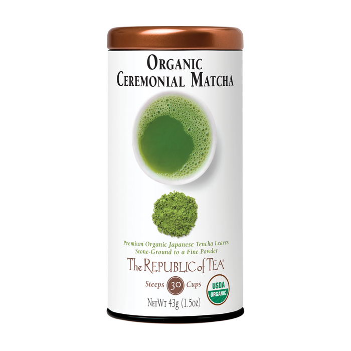A cylindrical tin of The Republic of Tea Ceremonial Matcha Powder Green Organic Tea, displaying a cup of green matcha and stone-ground powder on the white label with USDA Organic certification.
