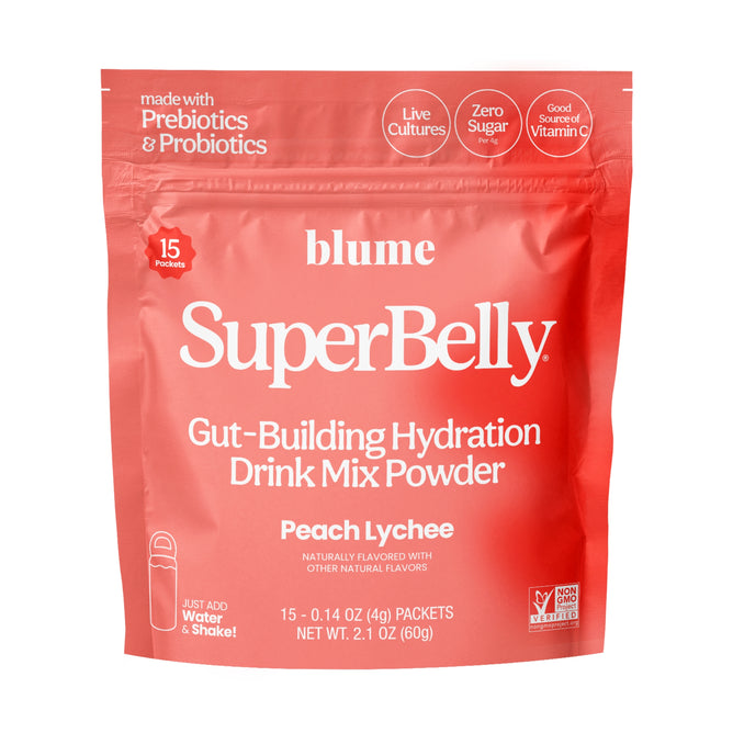 A red pouch labeled blume SuperBelly Gut-Building Hydration Drink Mix Powder Packets, Peach Lychee, highlights gut health with prebiotics, probiotics, live cultures, zero sugar, vitamin C, and includes 15 packets.