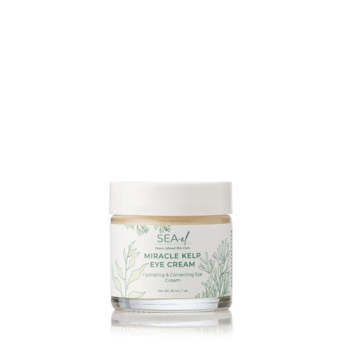 A jar of Sea-el Miracle Kelp Eye Cream with a white lid and clear container features a botanical-themed label with green seaweed, providing hydrating and correcting benefits to target puffiness and dark circles.