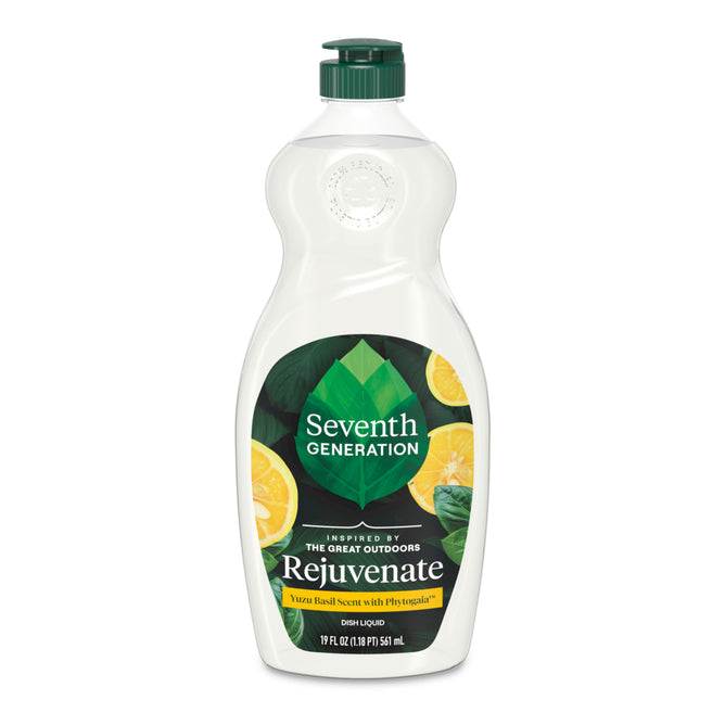 A bottle of Seventh Generation Dish Soap with a green cap features yellow citrus slices and green leaves on the label, highlighting its Yuzu & Basil scent with essential oils, plant-based ingredients, and EPA Safer Choice certification.