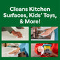 A collage of four images shows people using wipes on a kitchen counter, stove, bathroom sink, and toy truck. Above it reads Cleans Kitchen Surfaces, Kids’ Toys & More! against a green backdrop. Powered by plant-derived cleaning agents from Seventh Generations All Purpose Cleaner.