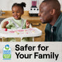 A smiling man and toddler sit at a kitchen table. The toddler, in a high chair, plays with food as a blender hums softly. The Safer Choice logo indicates Seventh Generations All Purpose Cleaner uses plant-derived agents, ensuring its safer for your family.