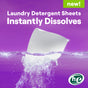Seventh Generations Laundry Detergent Sheets are highlighted in the packaging. A white sheet dissolves instantly in water on a purple background, featuring a green he logo in the lower right corner, showcasing its hypoallergenic and stain-fighting qualities.