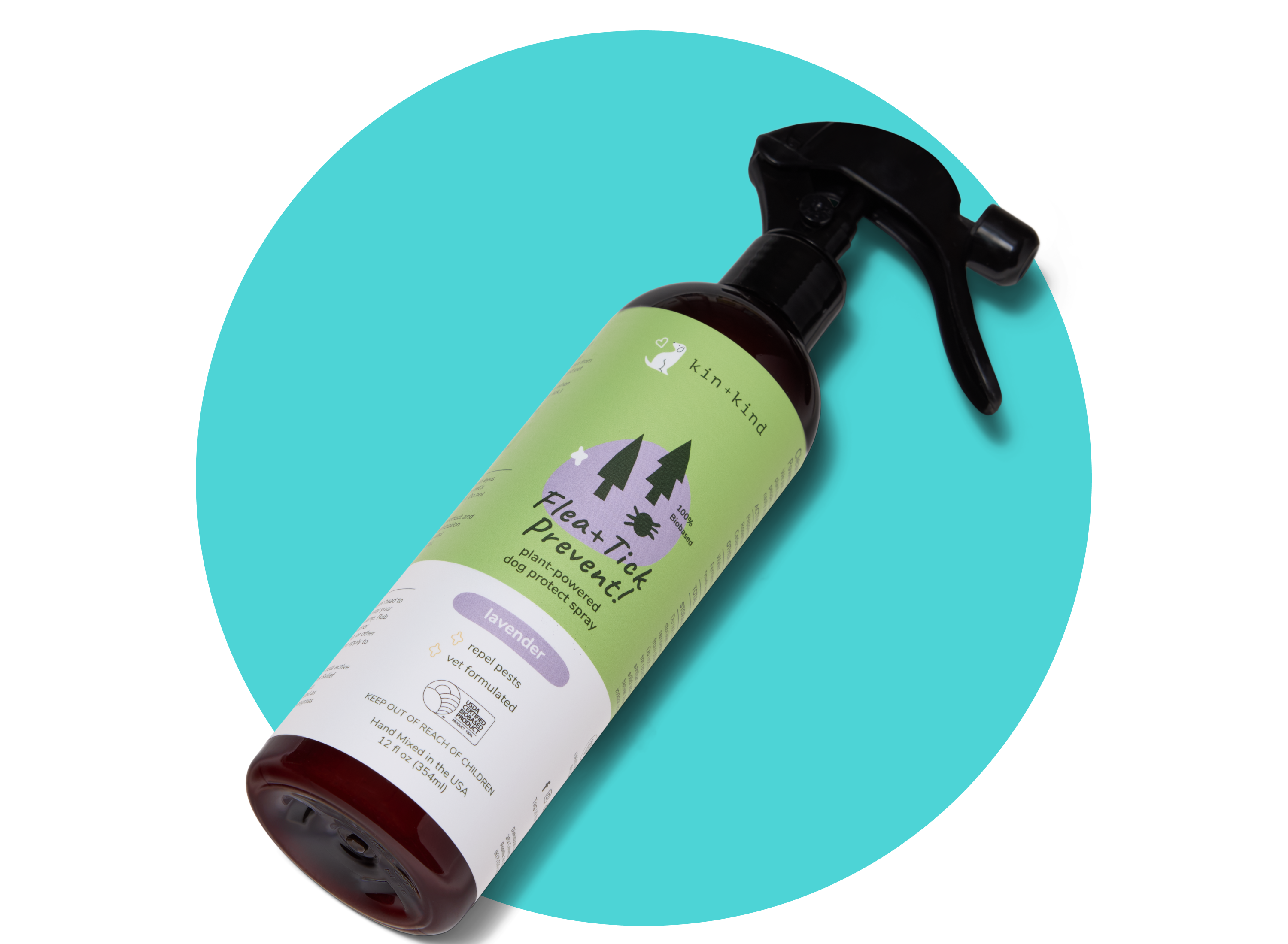 A spray bottle of kin+kind Flea+Tick Prevent Lavender scent pet spray is placed on a teal circular background. The label is green and purple with tree graphics and certification icons.