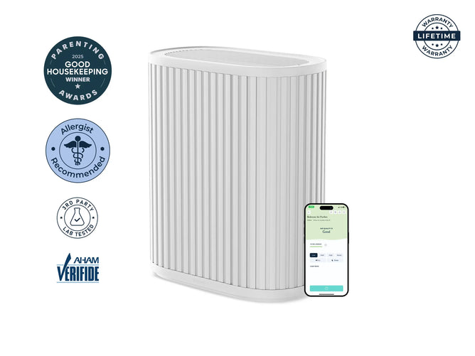 The Windmill Air Purifier Max by Windmill Air is a white HEPA air purifier with vertical grooves, shown alongside a smartphone displaying an app. Surrounding badges emphasize its awards, allergist recommendation, lab testing, AHAM verification, and lifetime warranty. Engineered to improve indoor air quality, it includes an activated carbon filter for advanced purification.