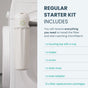 A close-up of the PlanetCare 2.0 Microfiber Filter Kit by PlanetCare attached to a white washing machine shows its microplastic removal filter. Text lists kit items: housing top, holder, screw, drain hose, hose adapter, and 13 filter cartridges.