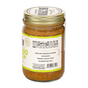 A glass jar of Big Spoon Roasters Pistachio Crunch Almond Butter with a gold lid, made with heirloom Mission almonds, California pistachios, organic maple syrup, and Jacobsen sea salt.