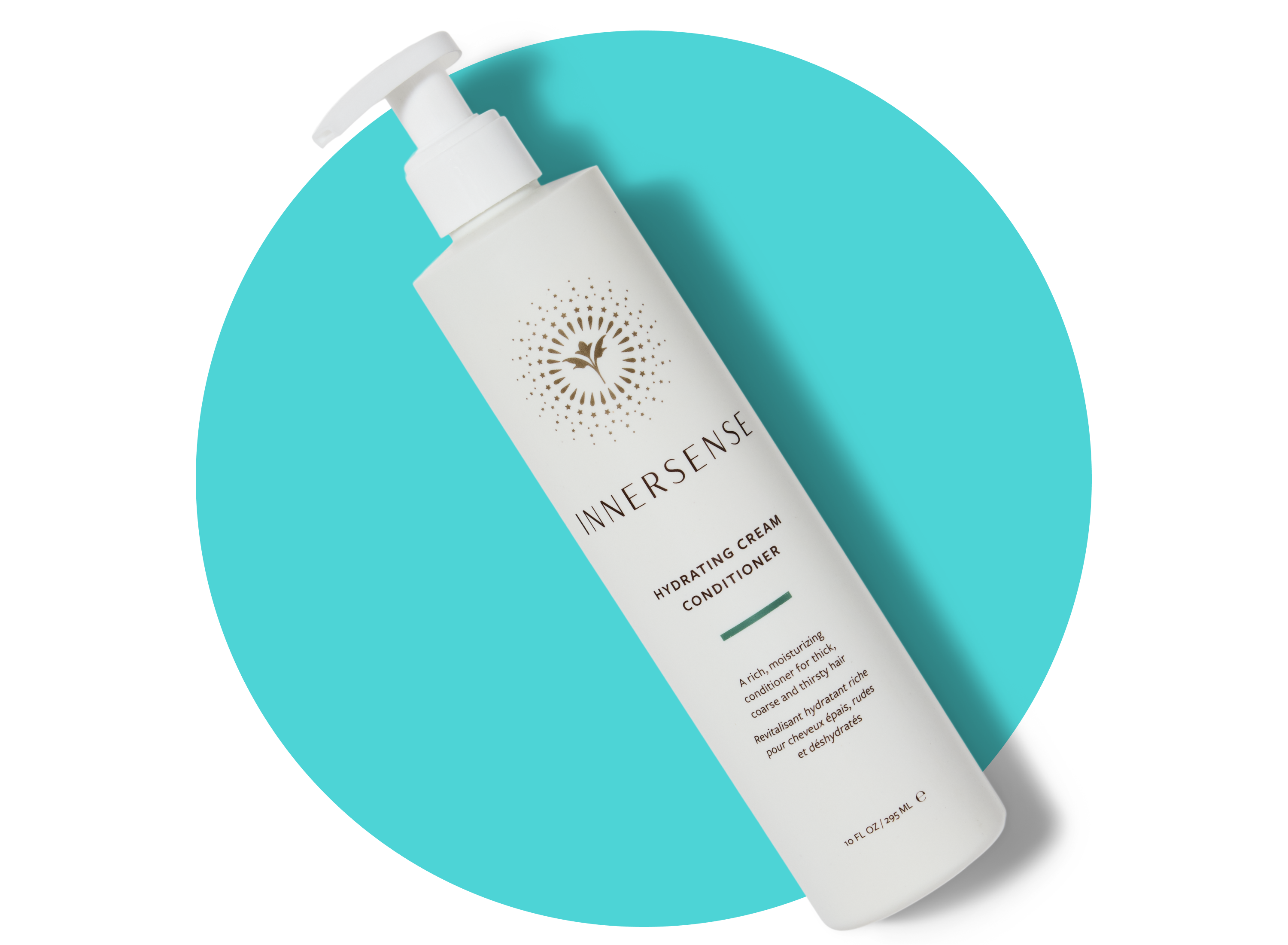 A white bottle of Innersense Hydrating Cream Conditioner with a pump top is shown on a turquoise circular background. The label features gold accents and text describing the product.