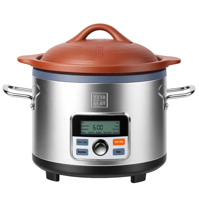 The VitaClay® Chef VITACLAY NourishingPot™- VM1688-9 features a stainless steel exterior, digital display with control buttons, convenient side handles, and a natural brown clay lid. Its screen displays a 6-hour timer, making it ideal for preparing bone broth or other slow-cooked meals.