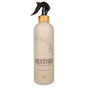 A beige spray bottle labeled Yoloha Yoga Mat Cleaner 16oz with eucalyptus and lavender scents. This organic essential oil spray features a bamboo top, a black sprayer, and a simple floral design—perfect as a mat cleaning spray, even for cork yoga mats.