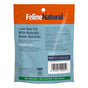 Back of a Feline Natural Grain-Free Freeze-Dried Cat Treats package: Made with natural New Zealand ingredients, no grains, gluten, or artificial additives. Packaging is orange and blue with a barcode at the bottom right.