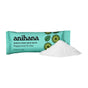A teal packet labeled Anihana Muscle Soak Bath Salts sits beside a small pile of white salts. Featuring lime and mint leaf illustrations, these bath salts are ideal for a single relaxing soak.