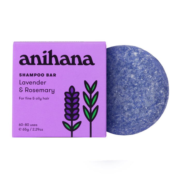 A purple Anihana Shampoo Bar (Fine & Oily Hair) box with lavender and rosemary designs sits beside a round blue bar, highlighting this sustainable shampoo made for oily hair.