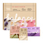 Soapymania's Body Care Set, labeled Balance, features rose, oatmeal, and lavender. The eco-friendly vegan box notes it's sulfate-free and includes exfoliating bar soap, a loofah, and sugar scrub cubes in front.