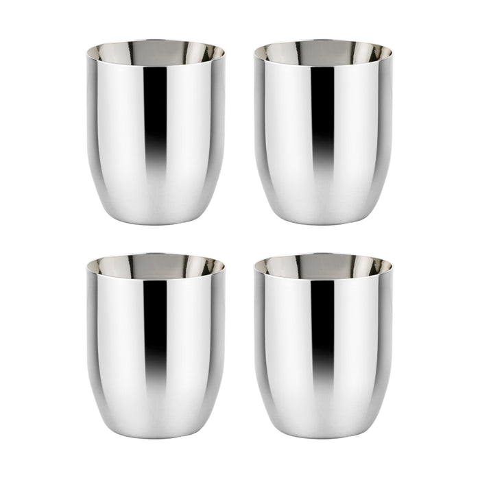 Four Ahimsa Conscious Cup stainless steel kids cups are arranged in a two-by-two grid on a white background. Designed for toddlers, these open cups have smooth, rounded shapes and shiny, reflective finishes.