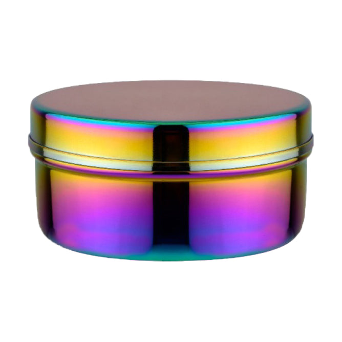 The Large Circle by Ahimsa is a round, stainless steel food storage container with a screw-on lid and an iridescent rainbow finish in purple, gold, blue, and green. Non-toxic lunch box shown on a plain white background.