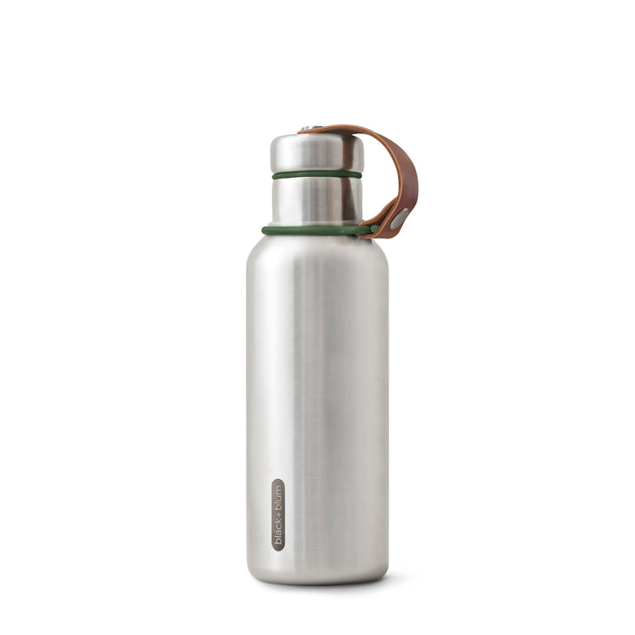 The Black + Blum Insulated Water Bottle stands upright on a white background, featuring a stainless steel body, rounded silver cap, green neck accents, and a brown leather strap attached to the lid.