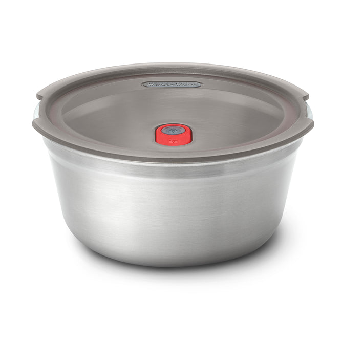 The Black + Blum Steel Food Bowl is a leakproof stainless steel lunch container with a matching lid featuring a center red valve, shown on a plain white background.