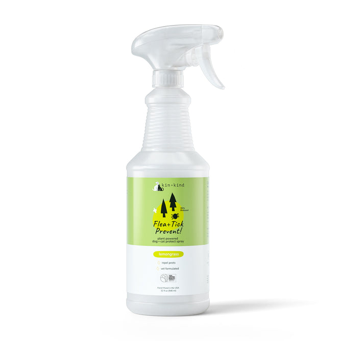 A spray bottle labeled Pet Flea & Tick Protect Spray for Dogs, with a green label featuring trees and lemongrass scent. This cruelty-free, vet-formulated dog protect spray by kin+kind uses USDA organic ingredients.
