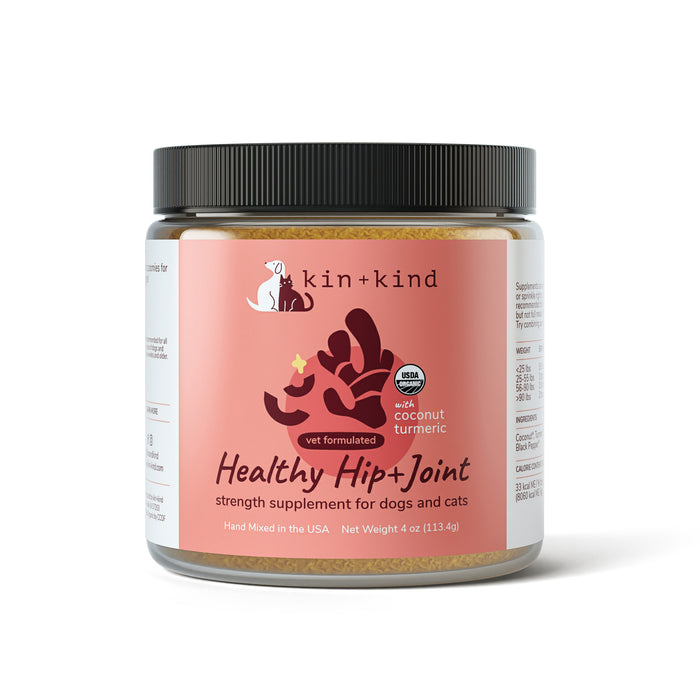 The kin+kind Hip & Joint Mobility Support Powder Supplement for dogs and cats, made in the USA and vet-formulated, acts as an anti-inflammatory supplement. Packaged in a 4 oz container, its label showcases a dog and cat silhouette with organic coconut and turmeric text highlights.