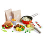 HABA Creative Play Food Meal Kit- Fresh Box includes a plush burger, felt vegetables, wooden meatballs and peas, a toy cooking pot with pasta, two paper bags, a play knife, and a recipe card.