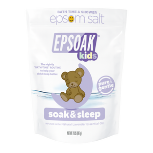 A white San Francisco Salt Co Kids Epsom Salts - Soak & Sleep Bath Salts bag with a cartoon teddy bear and lavender accents offers a pure, gentle bath soak infused with natural lavender essential oil for relaxing kids’ bath time.