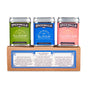 Three Spicewalla Hot Chocolate Drink Mix Collection tins—Mexican, Classic, and Cinnamon Roll—rest on a labeled box. Each blend is crafted with Spicewalla spices for rich, flavorful hot chocolate.