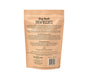 The brown paper packaging of Upcycled Dog Brew Biscuits by Portland Pet Food Company details ingredients and feeding guidelines for their dog treats made from upcycled spent grains.