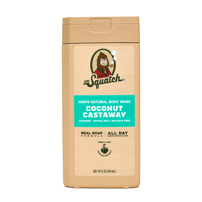 A 14 fl oz (414 mL) tan bottle of Dr. Squatch Body Wash in Coconut Castaway, featuring a bearded cartoon man on the label; this men's soap is free from parabens, phthalates, and sulfates.