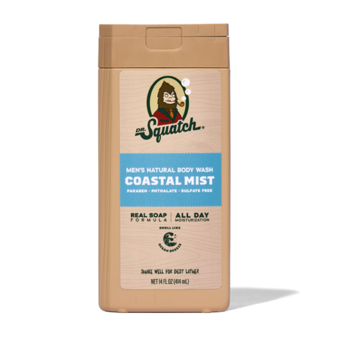 A tan 14 oz bottle of Dr. Squatch Body Wash in Coastal Mist with a blue label and Sasquatch logo. Made with natural ingredients, it’s free from parabens, phthalates, and sulfates.