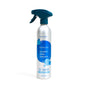 A silver spray bottle labeled Grove Co. Laundry Stain Remover — Made with Powerful Stain-Fighting Enzymes, featuring a blue trigger and label, stands upright on a white background.