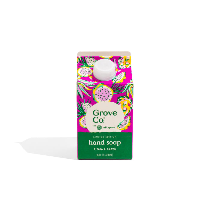 A vibrant carton of Grove Co. Hand Soap Refill - Summer Collection in Pitaya & Agave scent, with tropical fruit art on a purple background. The plant-based, moisturizing formula features aloe vera and comes in a white-capped carton with a green label.