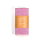 A rolled pink Large Turkish Towel - Summer Collection by Grove Co., made from 100% organic cotton, wrapped with a brown paper label featuring the brand and product details.