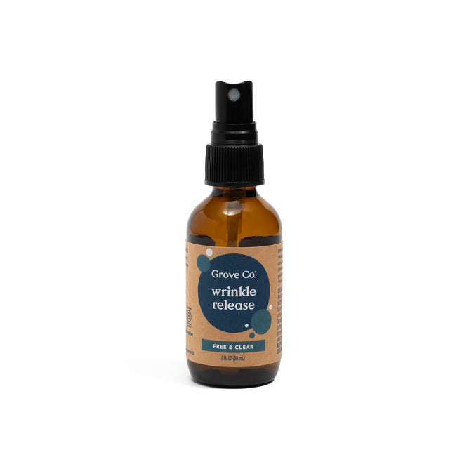 Grove Co. 2-in-1 Wrinkle Release - Travel Size comes in a brown bottle with a black nozzle and beige label, fragrance free and ideal for travel, shown standing upright against a white background.
