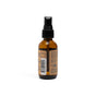 The Grove Co. 2-in-1 Wrinkle Release - Travel Size is a brown glass spray bottle with a black nozzle and back labels, offering a plastic-free, fragrance-free fabric spray, shown against a white background.