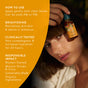 A woman holds a skincare bottle near her face; text beside her lists product benefits, usage instructions, and highlights that it is women-owned, sustainably made, organic skincare. Featuring Seabuckthorn Glow Beauty Oil by Badger Balm with biocompatible oil, this clinically tested formula is designed to brighten and hydrate skin.