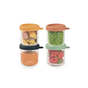 BEABA Glass Baby Food Jars, with colorful lids, neatly store homemade baby food like sliced vegetables, green peas, orange puree, and strawberries. Includes four jars arranged in two stacked pairs.